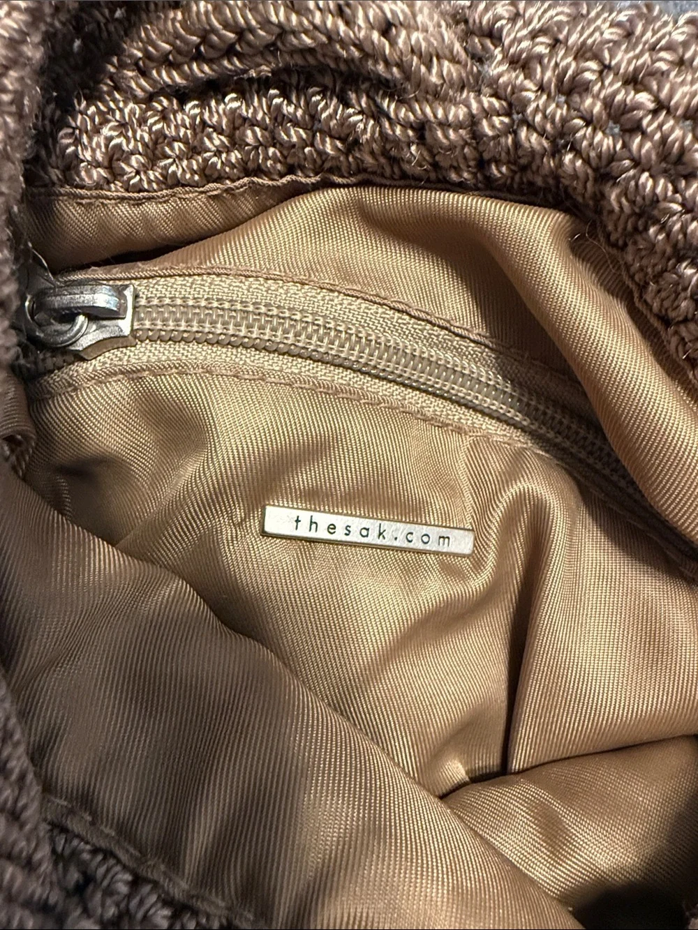 The Sak Crochet Drawstring Mini Backpack in Brown